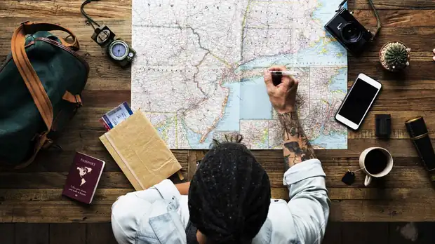 Travel documents and a map laid out for planning