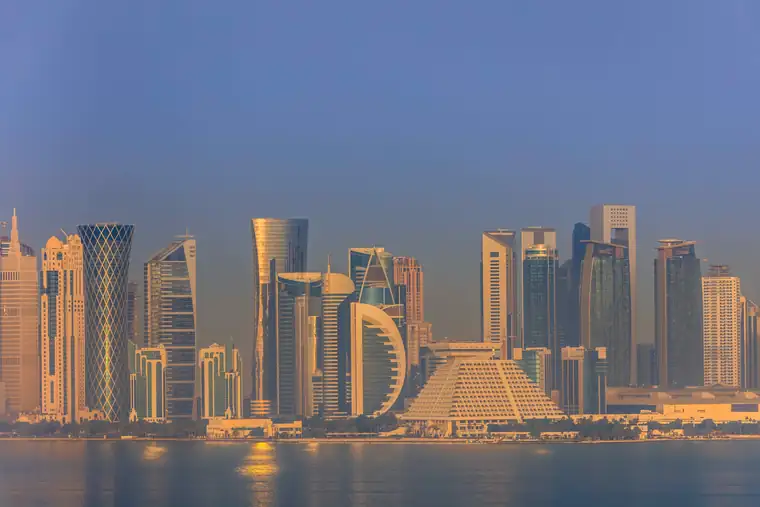 The Doha skyline at dusk seen from the Corniche